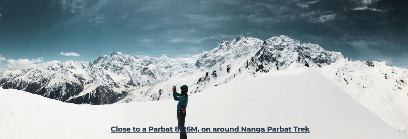 Trekkers hiking around Nanga Parbat 8126m during North Pakistan Adventure tour