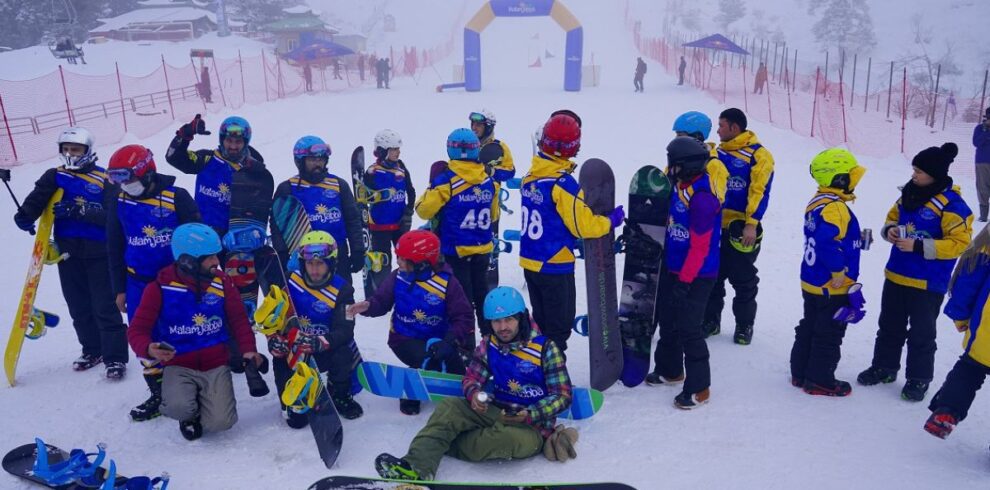 Adventurers ski touring on snow-covered peaks during a northern Pakistan tour in winter