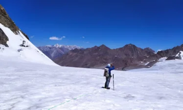 Climber Ascending Snowy Slope in Northern Pakistan