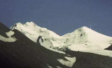 A group of trekkers make their way across a high-altitude plateau in the vast Khunjerab National Park.