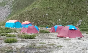 "Trekkers walking through a glacier in Charkusa Valley"