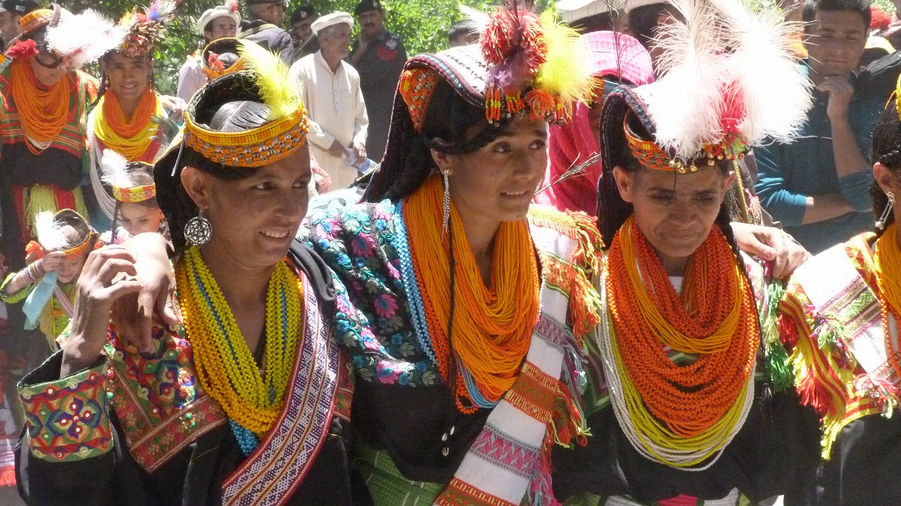 Traditional Kalash women dancing during the Kalash Valley Festival Tour in Bumburet Valley