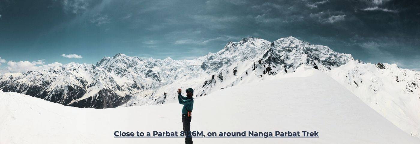 Trekkers hiking around Nanga Parbat 8126m during North Pakistan Adventure tour